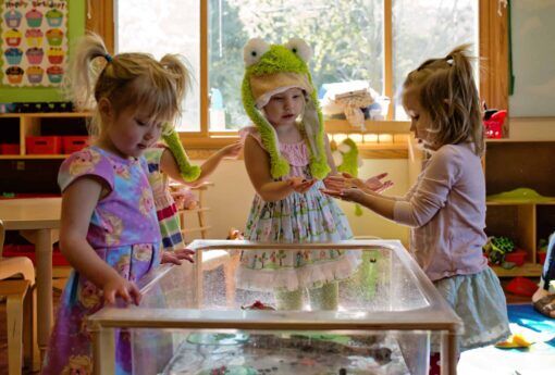 Preschool Children playing with a sensory table